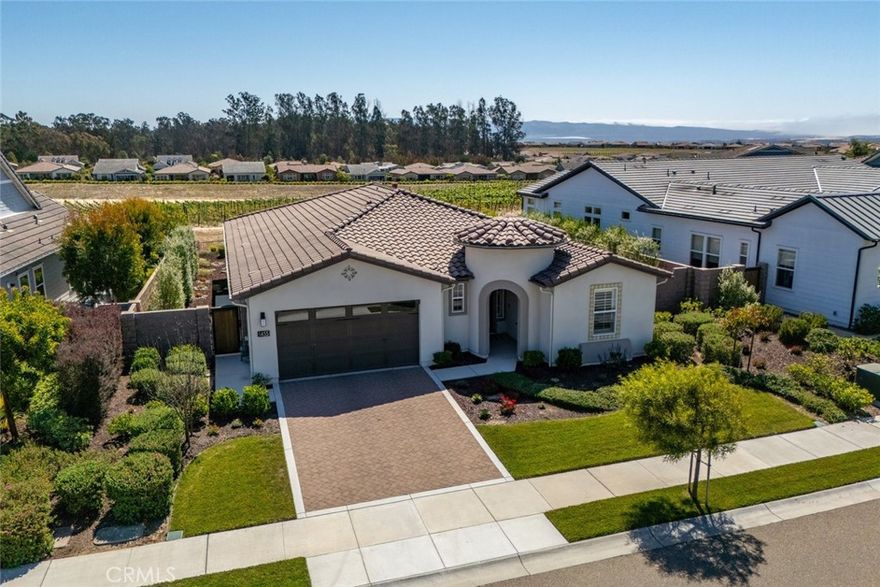Welcome to this stunning 3-bedroom, 2-bathroom Monterey home in the highly sought-after Trilogy community, built in 2021 and thoughtfully upgraded with over $80,000 in designer finishes. Ideally positioned on the street for privacy and tranquility, this residence boasts picturesque vineyard views and a serene backyard retreat.



Inside, the timeless design shines with white shaker cabinets, a large center island with a marble backsplash, and a soothing palette of white and grey tones throughout. Light-colored wide plank wood floors and fresh walls enhance the open floor plan, creating a bright, airy atmosphere filled with natural light.



Trilogy offers an unparalleled lifestyle with resort-style amenities including golf, tennis, swimming, fine dining, and a luxurious spa. This single-level stunner combines modern elegance with the very best of Central Coast living. Don’t miss the opportunity to make it yours—schedule a private showing today!