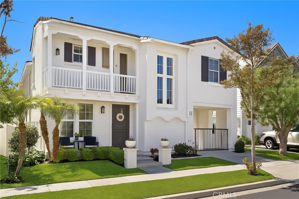 Discover the modern elegance of this charming culdesac home in the vibrant community of Ladera Ranch. This stunning property was Re-Piped and extensively remodeled with custom finishes worthy of a magazine feature. The charming white exterior with the custom window paned entry door and wrought iron driveway gate hints at the beauty beyond the exterior. Step into the reimagined floorplan with a convenient 4th Bedroom with thoughtful built-in closet and a full bathroom on the first floor. New LVP white oak look floors seamlessly flow throughout home highlighting the level 5 smooth drywall, the striking iron and wood staircase, built-in entry bench, natural wood plantation shutters, the reconfigured kitchen, and custom built-in media wall with floating shelves. This chef worthy kitchen elevates the culinary experience with a 48” slide in range with 6 gas burners, griddle and double ovens; an oversized range hood; farm basin sink; gorgeous chevron tile work; pot filler and walk-in pantry. Designer rattan chandelier illuminates the space as well as the black metal pendants and newly installed LED recessed lighting. Up the beautiful staircase are two secondary bedrooms, one with shiplap wall and both with custom closet organizers. Beautiful hall bathroom upgraded with white quartz counters with dual sinks, cantilevered black mirrors, charming vanity lights and tiled tub/shower area. The primary suite is oversized with a built-in media wall, and perfect nook for an exercise bike. The Primary bath is transformed into a personal sanctuary with a resort-style ambiance, featuring a floating poured-in-place concrete countertop, concrete bowl basin sinks highlighted with playful rattan pendants, a freestanding soaking tub, oversized polished concrete shower with frameless glass surround and a great closet with custom built-in organizers. Also on this floor are the laundry room, linen storage and built-in butcher block counter desk area. Enjoy the luxury of private outdoor space with bistro lights plus an exceptional outdoor space with an extended driveway with a gated entry and a unique porte-cochere, leading to a two-car attached garage with storage racks, tankless water heater, water softener and OWNED SOLAR PANELS. A Prime Location situated within walking distance to Poets Park, Oso Grande Elementary School, the Water park and numerous pools and parks. With the custom design and elevated features, this home embodies the essence of modern comfort and convenience.