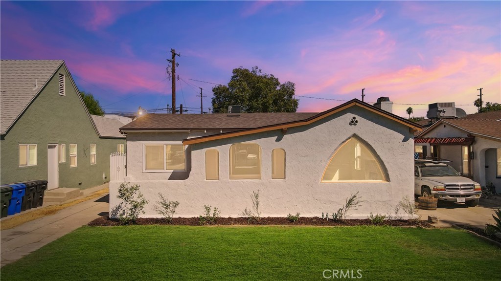 3 bedroom, 2 bathroom Spanish Colonial Revival home has been thoughtfully updated while maintaining its original architectural character. Recent improvements include new dual-pane windows, a new central air conditioning system, new roof shingles, new doors and baseboards, as well as all new light fixtures including recessed lights in the coved living room ceiling. The kitchen features new shaker cabinets with quartz countertops, and the living room has recessed lighting. Both bathrooms were remodeled with luxury tile and finishes. The property also offers new irrigation and landscaping in both the front and backyard, providing move-in ready outdoor spaces. A detached garage adds excellent potential for an ADU.