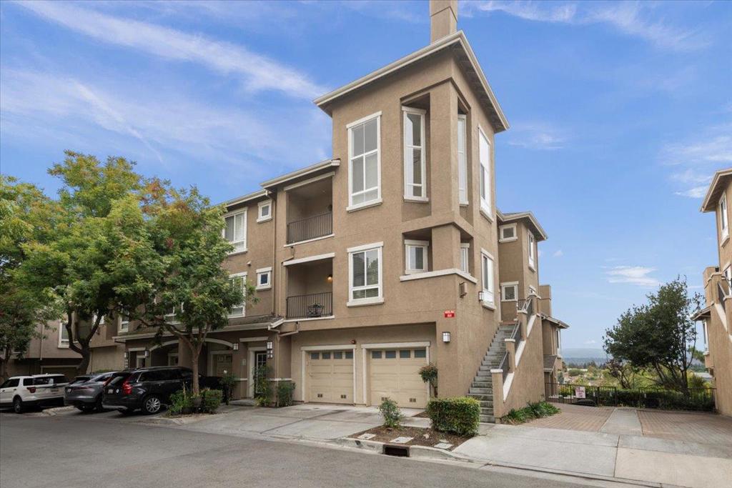 End-unit townhome in Lancaster Gate at the base of Communications Hill. Three ensuite bedrooms with walk-in closets, including a main-level suite and two additional suites on second level. The primary with vaulted ceilings, fireplace, and private balcony. Living room with tall ceilings, dining room and abundant light, tons of windows, and French door to balcony. Kitchen includes stainless appliances, gas cooktop, granite counters, casual eating area and glass sliding door to side entrance. Double pane windows, central A/C and 2 car attached garage. Steps from the renowned Comm Hill Grand Staircase, scenic walking and biking trails, and neighborhood parks with playgrounds. The community enhances your lifestyle with a sparkling pool, relaxing spa, and low HOA fees, while its prime location provides easy access to VTA Light Rail, Caltrain, downtown San Jose, shopping, and freeways 87, 85, 280, and 101.
