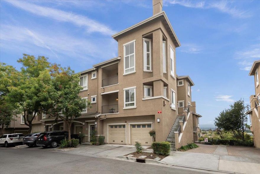 End-unit townhome in Lancaster Gate at the base of Communications Hill. Three ensuite bedrooms with walk-in closets, including a main-level suite and two additional suites on second level. The primary with vaulted ceilings, fireplace, and private balcony. Living room with tall ceilings, dining room and abundant light, tons of windows, and French door to balcony. Kitchen includes stainless appliances, gas cooktop, granite counters, casual eating area and glass sliding door to side entrance. Double pane windows, central A/C and 2 car attached garage. Steps from the renowned Comm Hill Grand Staircase, scenic walking and biking trails, and neighborhood parks with playgrounds. The community enhances your lifestyle with a sparkling pool, relaxing spa, and low HOA fees, while its prime location provides easy access to VTA Light Rail, Caltrain, downtown San Jose, shopping, and freeways 87, 85, 280, and 101.