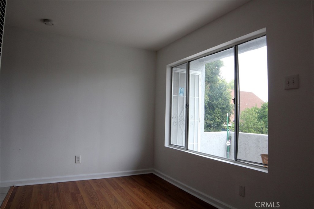 Well maintained second floor 1 bedroom 1 bathroom unit. Wood floors in the living areas and tile floors in the kitchen and bath. Fridge and oven included. Secured building. Laundry in building. All utilities (water, electricity, and gas) included for additional $100 per month. Street parking.