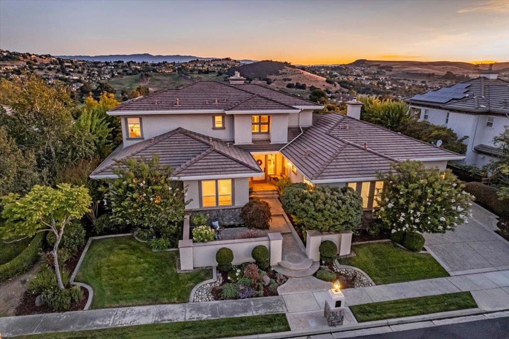 Step into luxury at 5433 Vicenza Way, an exquisite 4-bedroom, 4.5-bathroom home in the prestigious Silver Creek Country Club. This stunning home, spanning 4,188 sq. ft. with breathtaking views of the Silver Creek Golf Course, green belts and clubhouse. Sought after floor plan with showcases a first level primary suite. Primary bath is a spa-like retreat with a natural stone shower, jacuzzi tub, and a walk-in closet with built-in organizers. Two additional ensuite bedrooms on first level. Elegance of high ceilings and a gas fireplace in the spacious living room. Large hallways and two story ceilings leading into formal dining and private office. The upstairs features a loft area with an adjacent bedroom with show stopping views and adjacent covered terrace. The open concept kitchen boasts granite countertops and abundant cabinetry. Welcoming family room with stone fireplace and sliding door leading to an immaculately landscaped yard with a pergola, built-in BBQ, and hot tub for outdoor entertaining. Additional highlights include a solar energy system, three-car garage, two HVAC zones, and a central vacuum system. New carpeting and paint ready for move in. Minutes to the heart of Silicon Valley and all the Bay Area has to offer!