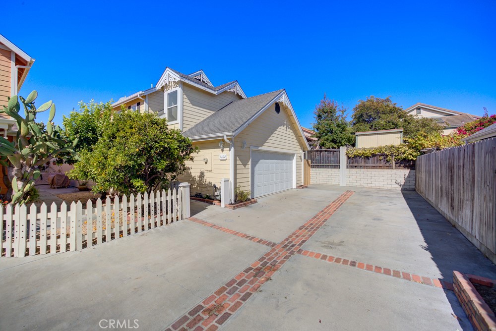 Discover this beautiful 3-bedroom, 2.5-bath, 1,694 sq. ft. home in the highly sought-after Village at Elm, located less than two miles from the beach and just minutes from the Arroyo Grande Village. NO HOA!! Situated on the north side of the community, this home does not have its entrance on Farroll, providing added privacy and easier access. Step inside to soaring ceilings, skylights, and a bright family room with fireplace that creates a warm, inviting atmosphere. Two blocks away from Harloe Elementary on Fair Oaks. Enjoy brand new vinyl flooring throughout the house and fresh interior paint, giving the home a modern, move-in ready feel. The spacious kitchen and dining area make entertaining easy, while the private primary suite offers its own balcony retreat. Outdoors, you’ll love the large, fully fenced backyard with plenty of room to run around, plenty of room to put a big cabana for lounging, space for pets, plants, etc. With a two-car attached garage and a rare oversized parking area for 2–3 cars outside, this home blends charm, functionality, and convenience in one of the Central Coast’s most desirable neighborhoods.
