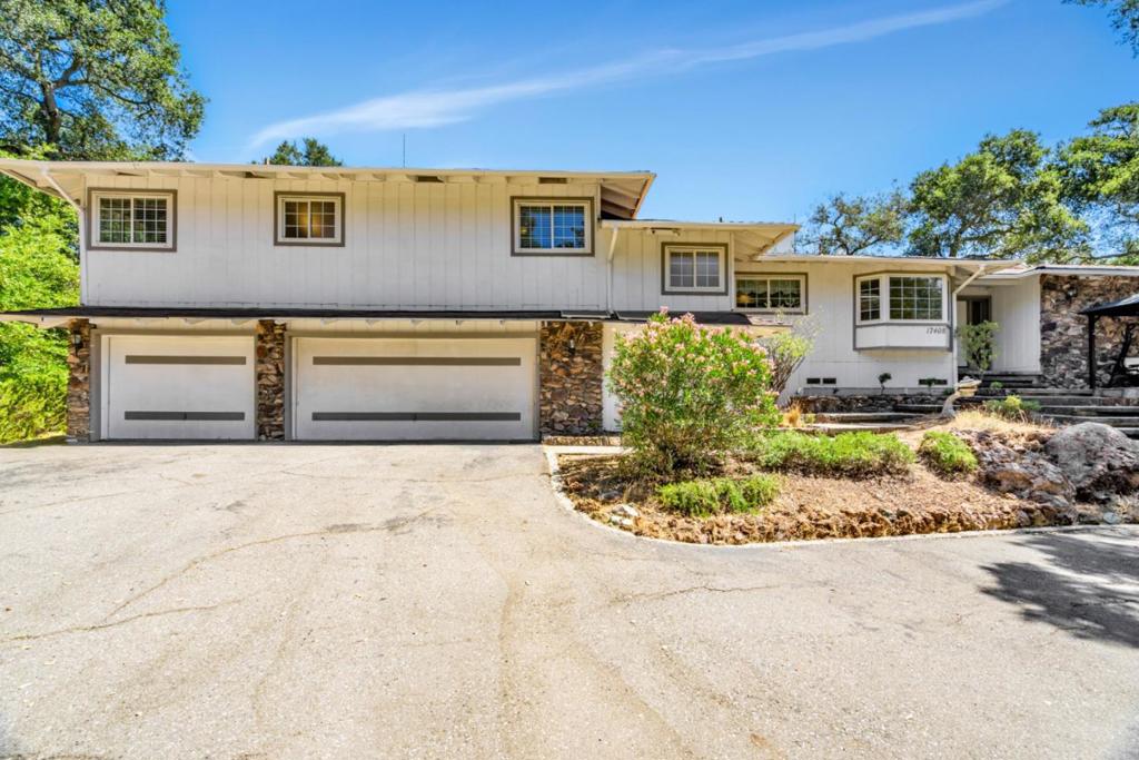 Resort-style living at its finest! This spacious 5-bedroom, 3-bathroom home sits on a mostly flat, half-acre+ lot in the desirable Holiday Lake Estates community. Designed for outdoor enthusiasts, the property features a basketball court, horseshoe pit, 3-hole frisbee golf course, and space for volleyball or bocce ball. The professionally landscaped front yard includes lighting and a Bluetooth speaker systemperfect for entertaining. Most of the living space is on a single level. The kitchen is light and bright, with stainless steel appliances, and the bathrooms are partially updated. Large windows and sliding glass doors fill the home with natural light and offer serene views. Enjoy cozy gas fireplaces in both the family room and the primary suite, which also includes a walk-in closet. Relax under the front porch arbor and take in the peaceful surroundings. The backyard offers a spacious deck, arbor, and a new shed. The flat side yard is ideal for RV parking or your personal sports/volleyball court. Imagine sitting beneath the arbor on the front porch or in the backyard, soaking in the wildlife and natural beauty. Located in the sought-after Nordstrom Elementary attendance area, this home offers the ideal balance of comfort, functionality, and an active lifestyle.