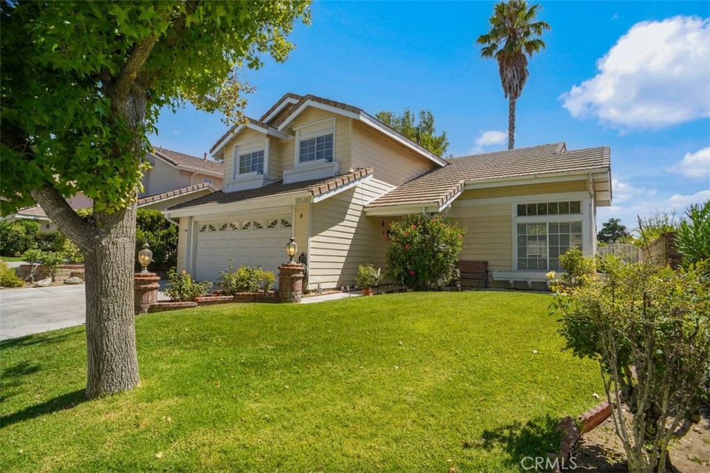 Highly desirable cul-de-sac location in the heart of Saugus. This three bedroom 3 bath home is very light and bright with lots of windows. Copper plumbing. There are double ovens, built in microwave and built in cooktop with five burners. The family room is good-sized with wood-burning fireplace.
Enjoy the large living room and dining area. Washer/Dryer are included and there is direct access to the two car attached garage. The garage has plenty of storage units. There is no Mello Roos and low HOA fee with access to a very private pool area, parks, tot lots and basketball court. Lovely patio area and grass area with beautiful mountain views.