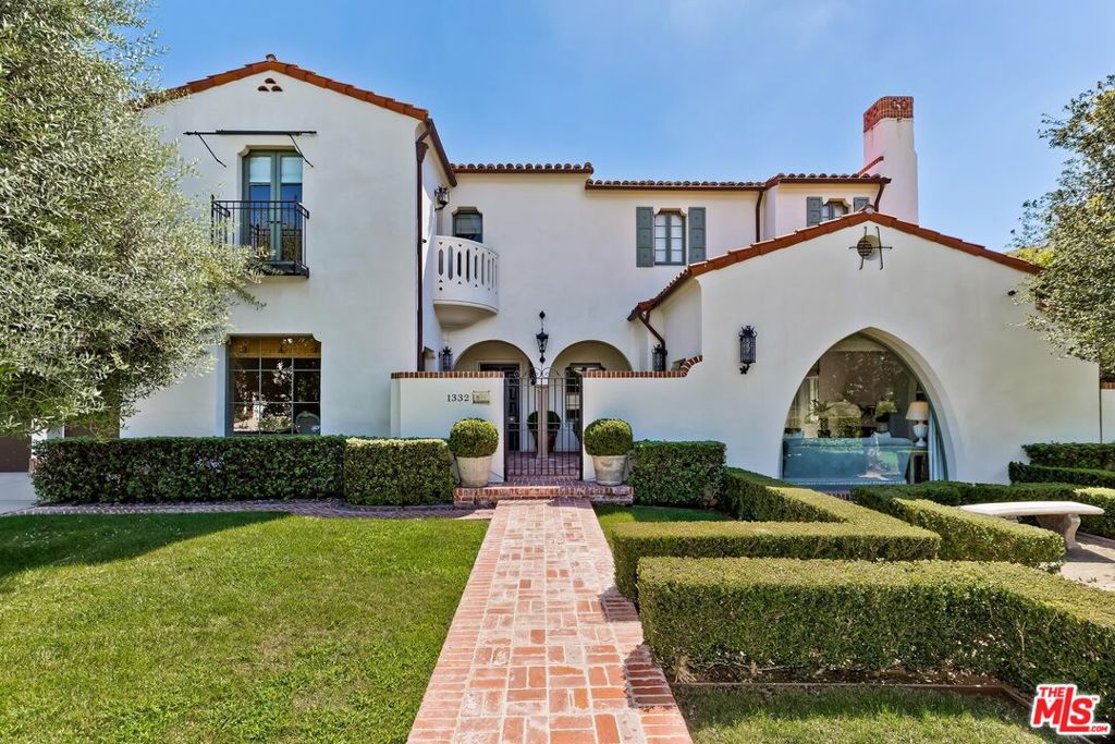Gorgeous Spanish Colonial home designed by renowned designer, Kevin A. Clark. Meticulously built by expert craftsmen, the design and detail of the home is unparalleled. The authentic ambience graces the interior that features hardwood and antique Spanish tile flooring, arching detailed hallways, exquisite woodwork, custom cabinetry, grand fireplaces, and authentic period tiles. The main floor boasts a sun-drenched breakfast room, formal living and dining room and separate study overlooking the backyard. The gourmet chef's kitchen features Wolf and Subzero appliances, a large center island, exquisite cabinetry, vintage lighting, and gorgeous arched French doors. Custom built in BBQ features Hestan appliances and a built in fire-pit. Upstairs is an exquisite primary suite with a cozy sitting room overlooking a lush garden and pool, with peek-a-boo ocean views. The luxurious bathroom with heated floors and a steam shower opens to an elegant and spacious closet. There are 3 additional bedrooms upstairs, with en-suite bathrooms and ample closet space. The basement includes a bedroom with en-suite full bathroom, a game room/theater, wine closet, and full-size laundry room. Other notable features include a water filtration system, Ozone pool, and elevator. This is truly an entertainer's delight that is also the perfect family home.