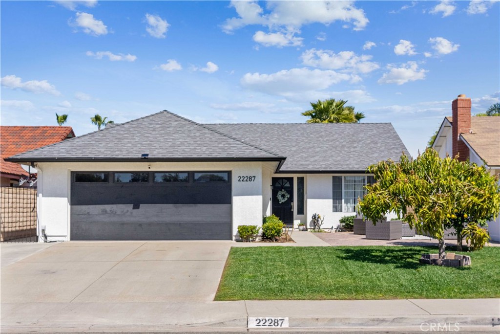 Welcome to this beautifully updated single-story residence located in the desirable community of Laguna Hills, just minutes from scenic Laguna Canyon. This move-in-ready home offers the perfect combination of modern comfort and timeless charm. From the moment you arrive, the manicured front yard and expansive pavered sitting area set the tone for inviting indoor-outdoor living. Inside, the light-filled floor plan features elegant crown molding, fresh interior paint, and durable luxury vinyl flooring throughout. The remodeled kitchen is both stylish and functional, showcasing sleek quartz countertops, a built-in buffet bar with floating shelves, generous cabinetry, and brand-new stainless steel appliances—including an electric range, microwave, and dishwasher. A breakfast bar seamlessly connects the kitchen to the spacious family room, which features a cozy fireplace and sliding doors that open to the private backyard. The primary suite offers a peaceful retreat with a beautifully updated bathroom that includes a marble-tiled shower. Both bathrooms have been tastefully remodeled with contemporary finishes.Elementary School and offers quick access to the 133, 405, and 5 freeways. With the Irvine Spectrum just minutes away and Laguna Beach less than 10 miles from your doorstep, this move-in-ready home provides the best of Southern California living! Offering convenient access to the 133, 405, and 5 freeways. Just minutes to the Irvine Spectrum and less than 10 miles to Laguna Beach—this is Southern California living at its finest.