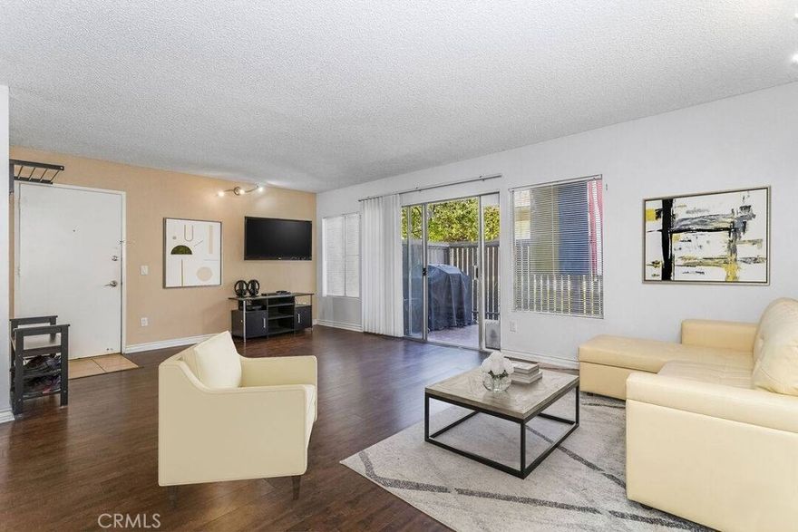 Beautifully updated 2BR/2BA condo in the gated Tara Village community of Tarzana, featuring a bright open-concept living and dining area with sliding glass doors to a private patio, a spacious kitchen with ample cabinet and counter space, a primary bedroom with en-suite bath and generous closets, and a versatile second bedroom with access to a second full bath. The unit includes central HVAC and two assigned tandem parking spaces. Tara Village offers park-like grounds and top-tier amenities including a heated pool and spa, kiddie pool, multiple BBQ areas, playground, basketball hoops, clubhouse, fitness center, community laundry room, on-site security and on-site management, with HOA dues covering hot and cold water, trash, gas, and sewer.