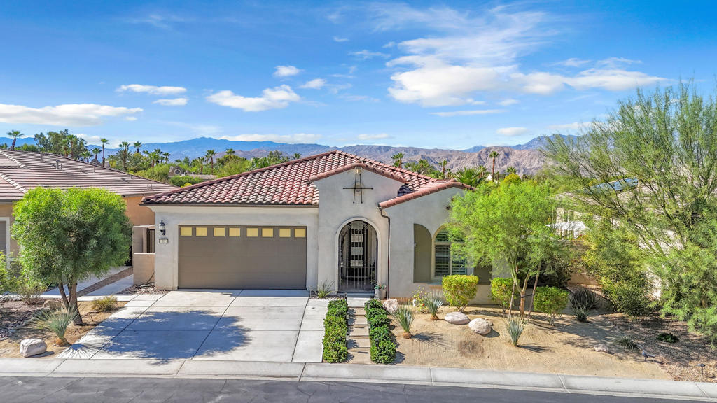 Welcome to your private desert retreat in the 55+ gated community of Del Webb Rancho Mirage! This highly desirable Preserve Model features 2 bedrooms + den (easily a 3rd bedroom), 2 baths, and a bonus flex room off the garage--perfect for a workshop, studio, or ''man-cave.'' The open-concept great room with custom bar flows seamlessly into the gourmet kitchen with stainless appliances, upgraded cabinetry, large island, and walk-in pantry. Multi-panel glass sliders lead to an expansive covered patio with tiled flooring, fire pit, commercial misting system, heaters, and remote-controlled sunshades--perfect for year-round entertaining. Enjoy low-maintenance landscaping, a private hot tub, and stunning mountain views. Residents enjoy resort-style amenities including a clubhouse, fitness center, pools, pickleball, tennis, bocce, and a vibrant social calendar.