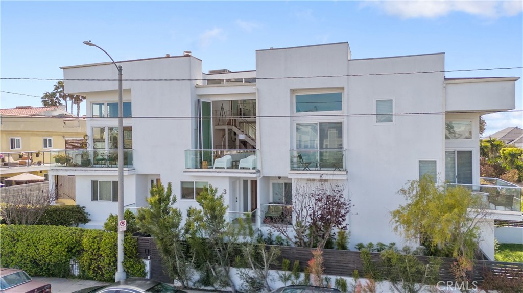 Welcome to 30 Reef #3 where ocean & canal views meet modern luxury. Experience coastal living on the Marina Peninsula at its finest in this fully remodeled Marina Del Rey residence, thoughtfully designed with no detail overlooked. This home offers a seamless blend of indoor-outdoor living with 12-foot sliding/folding glass doors that open the living space onto a spacious balcony. The open-concept main level features a gourmet kitchen, elegant dining area, powder room and a stunning living room with soaring two-story ceilings and a cozy fireplace—perfect for relaxing or entertaining with breathtaking water views. Three luxurious suites offer flexible living: The primary Suite, located on the top floor for maximum privacy, this oversized retreat features a retractable glass panel wall overlooking the living room and views of both the canal and ocean. A full wall of sliding glass doors provides privacy or transforms the room into a flexible, open space to suit your lifestyle. The second suite features rich hardwood floors, dual closets, and a spa-inspired ensuite with dual sinks and a walk-in shower. The private entry suite offers its own entrance next to the front door and tranquil canal views—this rare aspect allows for a 3rd bedroom or a guest suite separate living space. Additional highlights include keyless entry, recessed lighting, hardwood flooring throughout, and a modern HVAC system ensuring year-round comfort. A spacious 2+ car garage and extra storage round out this exceptional offering. Located just moments from the beach, Venice Canals, Abbot Kinney, Venice Pier, Silver Strand, and Marina—this is more than a home, it's a lifestyle. Be the first to live in this beautifully reimagined space and make the most of everything Marina Del Rey has to offer.