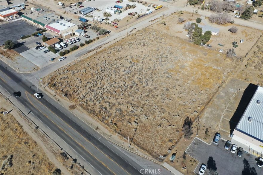 Positioned along Phelan Road, this 2.54-acre commercial parcel offers an exceptional opportunity in one of the High Desert’s fastest-growing corridors. The property provides easy access to major roadways and nearby amenities, ensuring both visibility and convenience—two critical drivers for long-term commercial success.



Zoned PH/CG (Commercial General), the site supports a wide variety of commercial uses, allowing developers flexibility to align with market demand. The inclusion of two water shares enhances development potential, while the area’s low vacancy rate underscores the strength of the local market and the need for new, well-positioned projects.



Adding to its value, preliminary work has already been completed for three distinct development concepts, all available for review—helping reduce upfront due diligence and accelerating timelines from acquisition to groundbreaking. This is a rare chance to control a versatile parcel in a proven growth market.