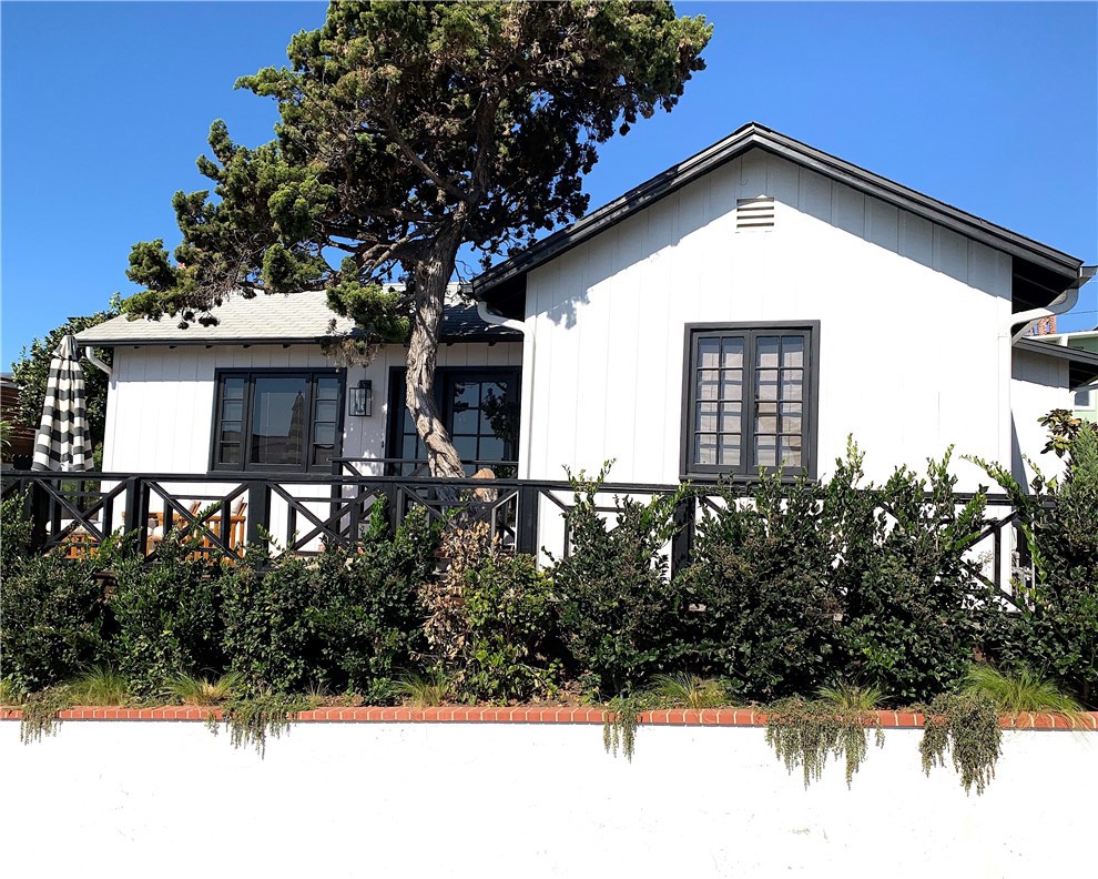 Welcome to your dream beach cottage at 31695 Seacliff Drive in the heart of South Laguna Beach. This charming 2-bedroom, 2-bathroom home offers 1,000 square feet of thoughtfully restored living space, capturing the essence of a classic beach bungalow. Enjoy breathtaking ocean views and the soothing sounds of crashing waves from your private beach access, located on the ocean side of Coast Highway.
Step inside to find a spacious living room with high beamed ceilings, a cozy fireplace, and beautiful hardwood floors. The updated kitchen boasts high-end appliances, perfect for culinary enthusiasts. Each bedroom features its own bathroom, providing comfort and privacy.
Outside, immerse yourself in the beauty of lush gardens and two inviting patio areas, ideal for dining al fresco. An outdoor shower with hot and cold water awaits after a day at the beach. With a two-car garage and additional driveway parking, convenience is at your doorstep.
Available during the summer months for $12,000 per month, this cottage is a private oasis just moments from South Village's vibrant shops and restaurants.
