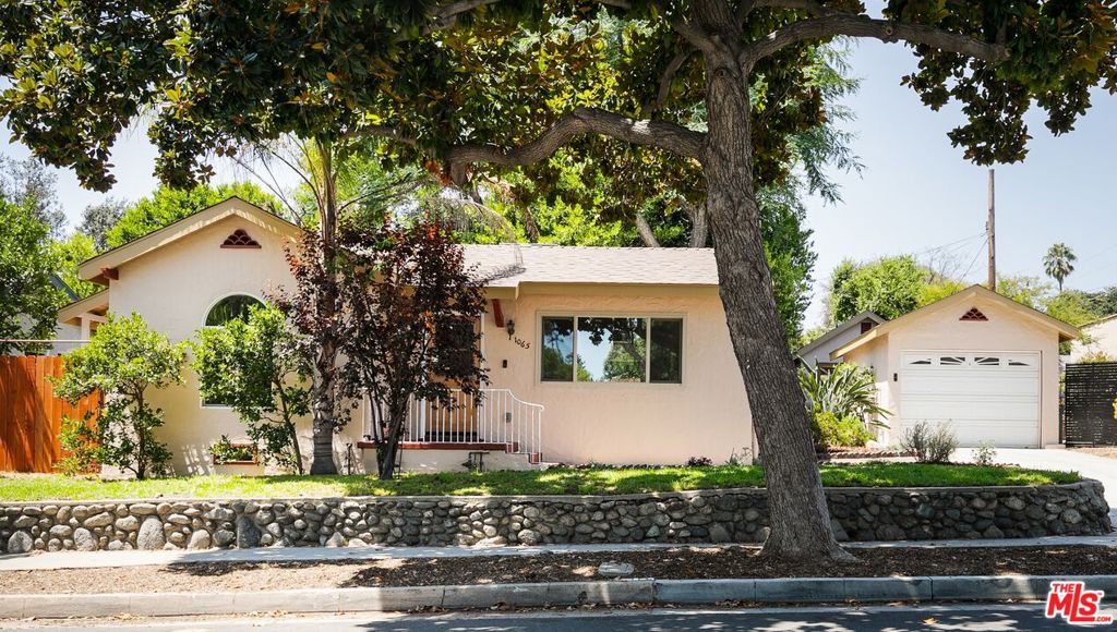 Situated on a picturesque tree-lined street in Pasadena's prestigious Orange Heights neighborhood, this delightful Spanish home blends timeless charm with thoughtful updates. Barrel ceilings, an original fireplace, and built-in details exude character, while the updated kitchen and bathroom incorporate subtle nods to classic Spanish architecture. Landscaped grounds enhance the home's curb appeal and create a welcoming atmosphere. Designed for seamless indoor-outdoor living, the home offers multiple access points to a series of patios, sitting areas, and a charming gazebo, perfect for entertaining or enjoying a quiet evening under the stars. A detached garage adds convenience, while mountain views provide a beautiful backdrop to everyday living. Located just moments from Old Town Pasadena, this inviting home offers the perfect combination of historic style, modern comfort, and California outdoor living.