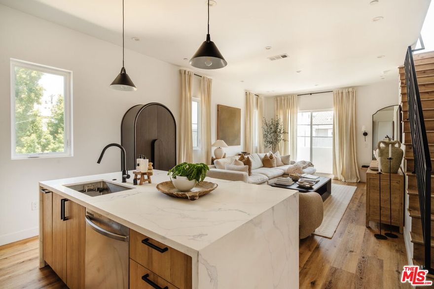 ** PET FRIENDLY ** PRIVATE ROOFTOP DECK ** WASHER/DRYER ** CENTRAL A/C ** PRIVATE 2 CAR GARAGE ** BALCONIES ** MODERN FINISHES ** Welcome to Maplewood Townhomes at 4460 Maplewood Ave, Los Angeles, CA 90004, where modern elegance meets the heart of the city! Discover this stunning 4-bedroom, 3.5-bathroom townhome offering a private yard, a rooftop deck with breathtaking city and hillside views, and a location that perfectly blends convenience and culture, just south of Melrose Hill. Step inside to find a bright and airy open-concept living space with soaring high ceilings, engineered wood flooring, and large picture windows that fill every corner with natural light. The chef's kitchen is beautifully designed with quartz countertops, premium Samsung stainless steel appliances, and a large island perfect for both entertaining and everyday living. Each bedroom features its own en-suite bathroom, with modern finishes and thoughtful details throughout. Enjoy multiple private outdoor spaces from your private fenced yard, ideal for relaxing, pets, or outdoor dining, to the spacious rooftop deck where you can unwind under the stars and take in panoramic views of Los Angeles. Additional features include in-unit laundry, a private two-car covered garage, and central heating and cooling for year-round comfort. Located in one of LA's most desirable and evolving neighborhoods, you're moments from Larchmont Village, Silver Lake, and Hollywood, surrounded by trendy coffee shops, boutique shopping, art galleries, and some of the city's best dining spots. Enjoy easy access to the 101 and 10 freeways, LA Metro lines, and local favorites like Sqirl, Found Oyster, and Antico Nuovo. Whether you're commuting, exploring, or relaxing, Maplewood Townhomes offers the perfect mix of style, comfort, and location in the center of it all.