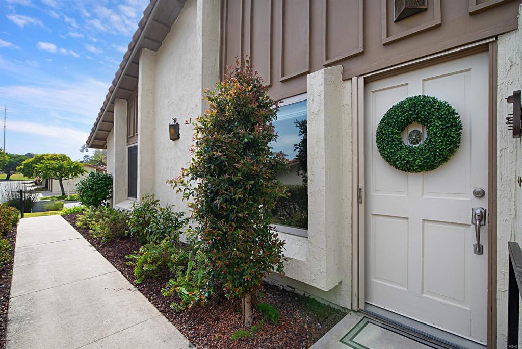 Welcome to this beautifully updated 3-bedroom townhome in the coveted 55+ community of High Country Villas. Boasting one of the Largest and most desirable layouts in the neighborhood, this single-level residence offers privacy, comfort, and resort-style living just minutes from the beach. Enjoy Maple hardwood flooring throughout—no popcorn ceilings here! The third bedroom is currently being used as a home office, perfect for remote work or a quiet retreat. Step outside to your private greenbelt backyard, featuring a charming brick patio with partial sunshade cover, ideal for enjoying cool western breezes all summer long. Modern upgrades include radiant heating, an A/C and heating split system in the living room with remote control, and marble vanities in both bathrooms. Residents of High Country Villas enjoy a rich array of amenities including executive golf, swimming pool and spa, clubhouse activities, and access to nearby hiking and biking trails. All of this is just under 4 miles to Moonlight Beach, and close to award-winning shopping, dining, and medical facilities. Don’t miss this rare opportunity to live in one of the most sought-after communities in Encinitas!