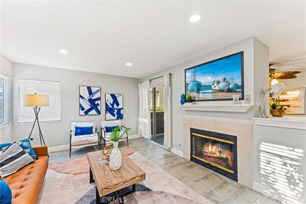 Welcome to 54 Corniche Drive, a beautifully updated ground-floor condo in the coveted, 24-hour guard-gated community of Ritz Pointe, just minutes from the sand, sea, and world-class resorts of Dana Point. This thoughtfully upgraded 2-bedroom, 2-bath home offers the ideal blend of comfort, style, and location. The open-concept living area welcomes you with a cozy fireplace, brand new recessed lighting throughout, and seamless access to a large, wraparound patio—perfect for morning coffee, sunset cocktails, or soaking in the ocean breeze. Just off the patio, you'll find your private laundry room, adding a layer of everyday convenience. The kitchen shines with quartz countertops, ample cabinetry, and a functional layout ideal for cooking and entertaining. Wide-plank vinyl flooring runs throughout the main living spaces, combining a modern aesthetic with easy maintenance. Both bedrooms feature brand new carpeting, oversized walk-in closets, and abundant natural light. The spacious primary suite includes a beautifully updated en-suite bath with new vanities, mirrors, and contemporary fixtures. Additional upgrades include complete home repiping in 2024 for added peace of mind. Enjoy resort-style amenities just steps away—relax at the pool and spa, stay active in the fitness center, or unwind in the clubhouse. An assigned covered carport is included for easy parking. Ideally located near Salt Creek Beach, the RitzCarlton, Monarch Beach Golf Links, Ocean Ranch Village, and the vibrant Lantern District, you'll have quick access to top-tier shopping, dining, hiking, and coastal adventures. Commuting is effortless with close proximity to John Wayne Airport and major freeways. Whether you are looking for a full time residence, a weekend escape, or a turnkey investment, 54 Corniche Drive #B offers the perfect opportunity to embrace the Southern California lifestyle. Don't miss your chance to own a piece of paradise in one of Orange County's most desirable neighborhoods.