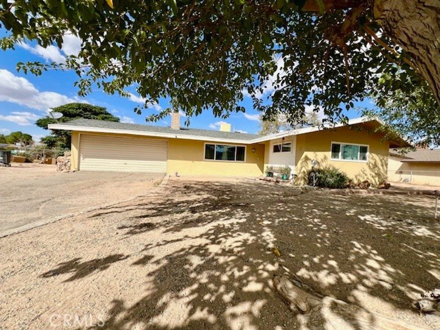 Discover this inviting and thoughtfully updated 3-bedroom, 2-bathroom family home in a prime Hesperia location- on the Mesa.  Designed for comfortable living, the functional layout flows effortlessly from  a bright ample living room with cozy fireplace to a completely remodeled kitchen and spacious bedrooms creating a welcoming space for guests and preserving privacy for the family. It's Move-In Ready with a host of recent upgrades: new flooring, upgraded bathrooms, new kitchen cabinets with lazy Susan corner cabinet, new granite counter tops, brand new matching Whirlpool appliances- refrigerator, stove with microwave, dishwasher, recessed kitchen lighting, new energy efficient windows throughout the entire home, new energy efficient central a/c, new smart thermostat for remote climate control, and new water heater. This home sits on almost half an acre with spacious front and rear yards, long driveway and plenty of extra space for your RV, boats, or other weekend toys. Located in a desirable location near golf course, shops, and. restaurants. This home is move-in ready and for an even smoother move-in, may come partially furnished.