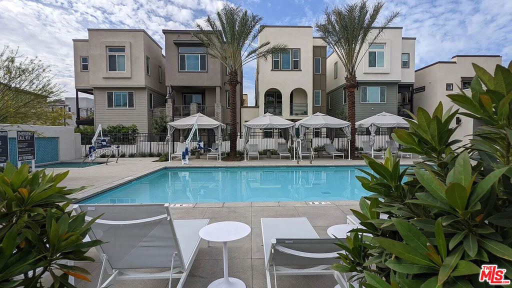 Welcome to modern luxury living with this tri-level home, part of the exclusive family-friendly Grace Park gated community and minutes from LA's burgeoning entertainment district in Inglewood. This corner lot is three bedrooms, 3.5 bathrooms, 2100 sq ft of space and offers an open-concept with high ceilings. Ample natural lighting throughout, engineered wood flooring, custom-made kitchen island with upgraded hardware, stainless steel appliances, quartz countertops, pantry, washer/dryer, walk-in closets, and an attached 2-car garage. Primary bedroom features ensuite bathroom with dual sinks and a deep soaking bathtub perfect for relaxation. Enjoy unobstructed sunshine on 2 connecting patio areas, featuring easy-to-maintain artificial grass, beautiful ficus trees, landscaping, and an irrigation system. Smart home equipped with Ecobee central air + heat control, electric vehicle charger, rooftop solar panels, and ADT system security cameras. Amenities include a palm tree-lined private pool area, jacuzzi spa, exercise equipment, clubhouse for entertaining guests, plenty of guest parking (2 visitor spaces included), and 24 hour security on premises. The community is a short walk to the Metro K-Line, a quick 15-minute drive to LAX, close to primary freeways, and 20 minutes from the beaches. Located near SoFi Stadium, The Forum, YouTube Theater, Intuit Dome, and Hollywood Park dining, shopping, and entertainment complex.Comes furnished as shown and decorated as needed. High-speed internet and security alarm camera system included. Tenant responsible for water, gas and electric (highly subsidized by solar panel system).