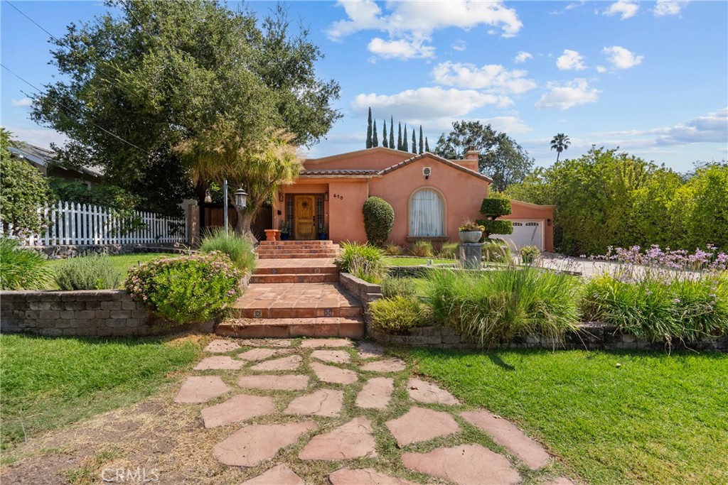 Welcome to this exceptional one-story Spanish Home on a large lot in one of the most desirable areas of Burbank. This home boasts 4 bedrooms and 2 bathrooms (2 bedrooms were converted into one and can be easily reversed), spanning 2103 square feet of living space and sitting on a huge 10,686 square feet lot, with an excellent floor plan and an amazing backyard, perfect for family gatherings or for entrainment. The lush, manicured front yard, the meandering brick path, the timeless facade it all hints at the character and quality waiting inside. This stunning Spanish home effortlessly blends architectural beauty with thoughtful modern updates. Step through the front door, and you're greeted by a space that feels both grand and inviting where rich saltillo floors throughout and wood floors in bedroom. You are greeted by a breathtaking high ceiling beams and an upgraded kitchen with granite counter-tops and plenty of storage. While the covered private backyard is an oasis to for outdoor seating and entertaining with a built-in in kitchen (BBQ, sink and plenty of counter space) Owner spent over 40,000 for this renovation.
This home exudes curb appeal and promises a delightful living experience. Don't miss the opportunity to call this modern Spanish gem in Burbank Hills your own! Conveniently situated within proximity to shopping centers, entertainment venues, renowned production studios, top-rated schools, golf courses, hiking trails, 5 Freeway and Burbank Airport, this estate offers unparalleled convenience and lifestyle opportunities. Don't miss this home. Welcome Home!
