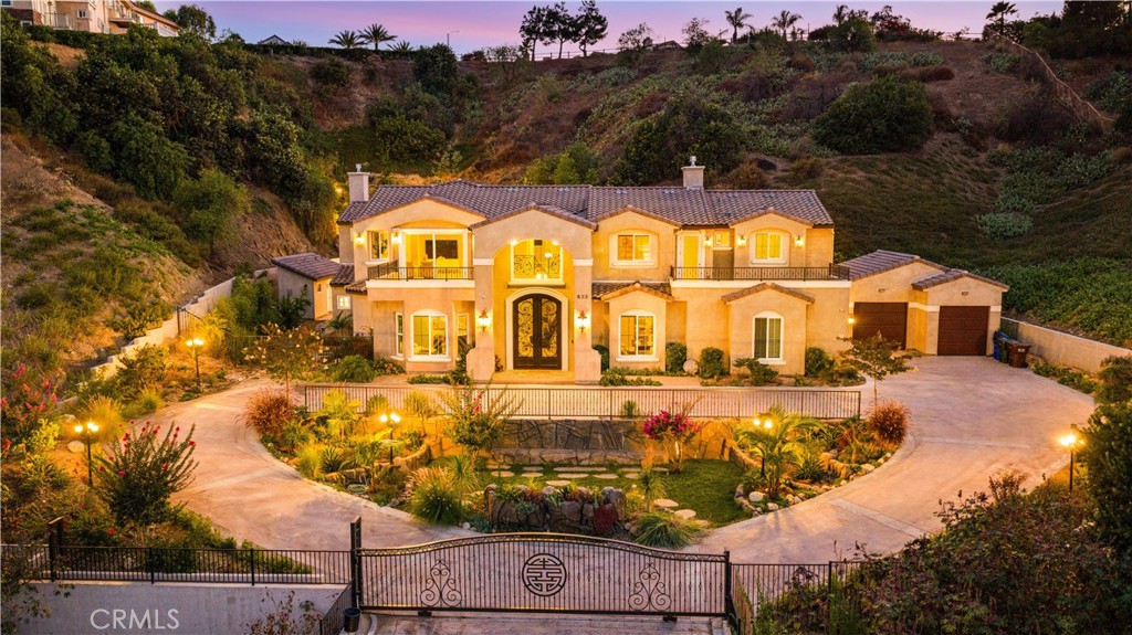 Welcome to this stunning, newly built custom-designed estate in the heart of Snow Creek, Walnut’s most coveted neighborhood with top-ranked Walnut School District. Every inch of this architectural masterpiece exudes elegance, function, and luxury, offering an unparalleled living experience with a private entrance gate and gorgeous views. Inside, the home greets you with soaring high ceilings, wide-plank floors, and a bright, airy layout. A private elevator provides effortless access to both levels, ideal for modern convenience and multi-generational living. The formal living and dining areas flow seamlessly into a designer chef’s kitchen, complete with quartz countertops, custom cabinetry, premium stainless steel appliances, and an oversized center island. Enjoy immersive sound everywhere with a high-end built-in stereo sound system that spans both indoors and outdoors, every room resonates with quality and intention.The expansive family room and dining area is a true showstopper, stuns with a coffered high ceiling and 9-foot-tall, multi-panel foldable sliding glass doors and coffered high ceiling that fully open to the backyard—creating the ultimate indoor-outdoor California lifestyle and showcasing breathtaking views of the backyard and mountains. This luxurious main residence offers four spacious en-suite bedrooms, including an opulent primary retreat, and a total of Five and half modern baths. An open upstairs den provides a peaceful perch with expansive views, ideal for a home office or lounge.The resort-style backyard is your private oasis: a sparkling pool with a waterfall and waterslide, relaxing spa, and wet & dry sauna rooms illuminated with ambient color-changing LED lights. Whether entertaining or unwinding, this space was crafted for total indulgence. Additionally, a separate-entry ADU offers a private one-bedroom, one-bath suite—perfect for guests, in-laws, or rental potential. From luxurious interiors and smart layout to spectacular outdoor living and unbeatable location, this Snow Creek gem is a rare and exquisite find, it offers privacy, prestige, and every luxury imaginable—inside and out. A true masterpiece in one of Walnut’s most sought-after communities. Conveniently access to Westhoff elementary school, Walnut high school, Mt. San Antonio College, Cal Poly Pomona, shopping centers, and major freeways (10, 57, and 60). Don’t miss this rare opportunity—schedule your private showing today before it’s gone!