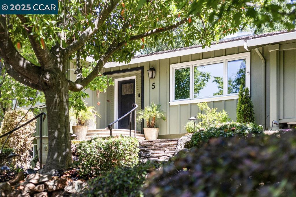GREAT VALUE! Carmel charm with a great location tucked in on a private court in South Walnut Creek. There are 5 bedrooms total, 4 bed/2 bath are on main level and separate apartment/in-law/au pair suite on the lower level with additional bed/bath/bonus room and mini kitchen with separate entrance. Perfect for overflow bonus space, teens, multi generational families, or a even a tenant. Beautiful moldings, hardwood floors, Chef's kitchen with high end appliances, pantry, amazing laundry room, and attached 3 season room, a perfect spot for morning coffee. Inviting terraced yard with entertaining and zen like relaxing spaces, hot tub, fountains, outdoor TV. Feels like a vacation! Your own private oasis! Minutes to the freeway, downtown Walnut Creek and walkable distance to elementary school and high school. This home has character, function, and a zen like feel. It is a beauty!