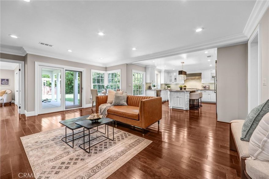 This exquisitely renovated two-story home, fully remodeled and expanded in 2014, boasts luxurious upgrades in the heart of San Marino’s serene, affluent neighborhoods. Featuring a spacious floor plan with a grand family room, gourmet kitchen with breakfast nook, 4 bedrooms, 4.5 bathrooms, a sophisticated den, and a versatile loft, this residence is designed for elegance and comfort. The chef’s kitchen showcases custom cabinetry, granite countertops, a large center island, and top-of-the-line Viking appliances, including a 48” built-in refrigerator, 6-burner stovetop, under-mount oven, and dishwasher. Two master suites offer deluxe bathrooms with double-sink vanities, Jacuzzi tubs, and separate showers. Additional highlights include central A/C, fire/security alarms, dual-pane Pella windows, and a fully refinished 2-car garage with epoxy-coated flooring. Located within the prestigious San Marino Unified School District, a National Blue Ribbon award-winner, this home is steps from top-tier elementary and middle schools.