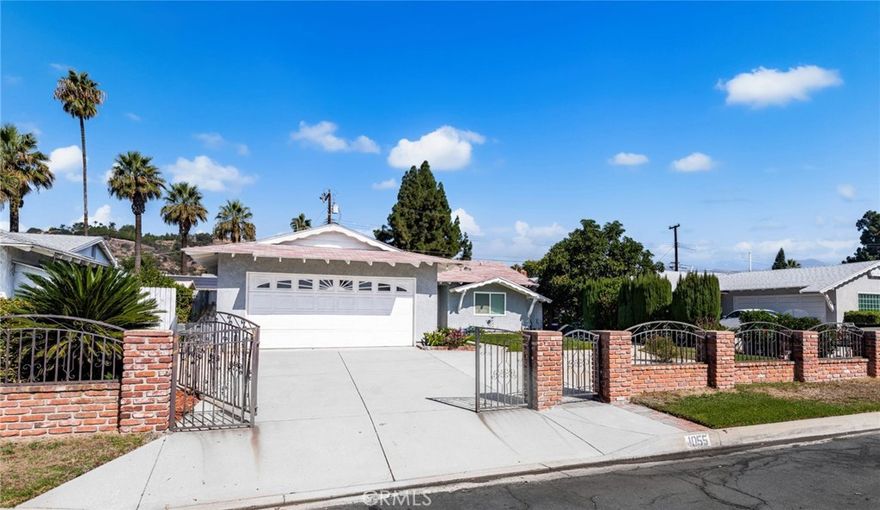 Charming single-story family home in Glendora, ready for a new chapter. This spacious 4-bedroom, 2-bathroom residence is bright and welcoming, with a functional layout that suits everyday living and entertaining.  With a large kitchen, this is a great space for family and friends to gather.  The dining room with skylight creates abundant natural light and an open concept.  The large family room is ideal for growing children or a quiet retreat.  The primary bedroom with generous walk-in closet and attached bath featuring a step-in shower.  This home has new flooring in all bedrooms and newer windows throughout.  The attached 2 car garage with direct entry into the kitchen for convenience.  The wide driveway offers ample parking for family and guests.  The yards have mature shrubs and trees.  Several local parks and family-friendly outdoor spaces; strong emphasis on a safe, community-oriented environment.  Foothills access for hiking and scenic drives in the San Gabriel Mountains.  Glendora Village (historic downtown) is a pleasant, walkable core with a mix of local businesses and community gatherings and features shops, eateries and with periodic community events.  Glendora is known for a small-town, suburban feel with a charming historic downtown.  A family-friendly city in the San Gabriel Valley, about 20 miles northeast of downtown Los Angeles.