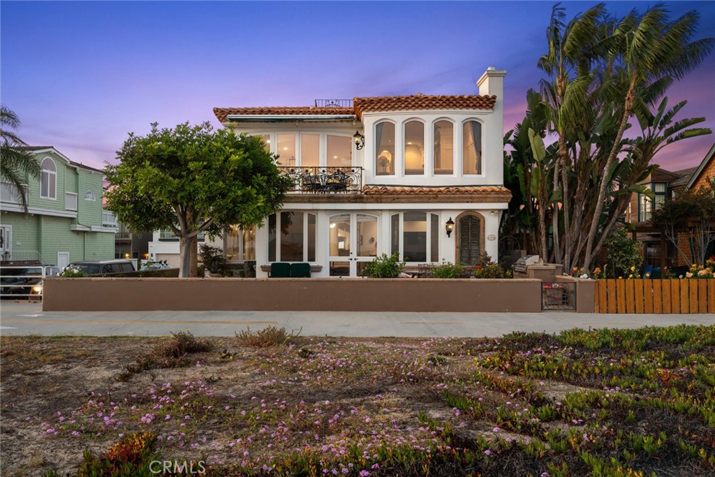 Introducing a once-in-a-generation opportunity to own a front-row property on one of the most sought-after stretches of sand in iconic Newport Beach. Perfectly positioned on a prime, oversized corner lot with 41 feet of beach frontage, this Brion Jeannette-designed home enjoys sweeping, unobstructed views of the ocean, bay, and coastline — a breathtaking backdrop for everyday living and entertaining alike. From the moment you arrive, the setting speaks for itself: panoramic vistas, the sound of waves crashing just beyond your doorstep, and a wraparound orientation that captures both sunrise and sunset skies. The floor plan offers flexibility with a main-level primary suite overlooking the sand, spacious guest accommodations as well as two additional guest bedrooms on the main level, a fourth bedroom on the upstairs/main level and an elevator servicing all three interior levels — including a rooftop deck with jaw-dropping views in every direction and a lower level wine cellar. Up the curved staircase from the entry foyer you will be greeted by an open concept living area bathed in light, with a gorgeous stone fireplace and water views at every turn. With garage and carport parking for six vehicles, this is coastal living without compromise. This is more than a home — it’s a rare chance to own an iconic slice of oceanfront in an unparalleled location.