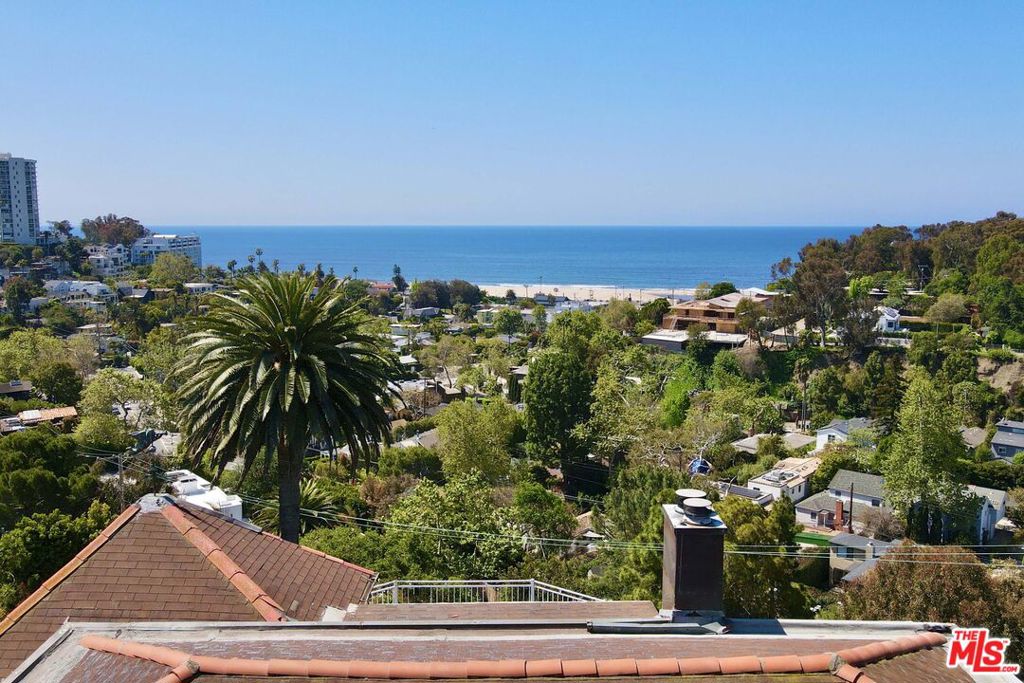 Perched atop the coveted upper Santa Monica Canyon hillside, this extraordinary home offers an unrivaled opportunity to own a truly one-of-a-kind ocean-view property. Set on a private promontory, the site commands breathtaking 270-degree panoramic views encompassing the Pacific Ocean, Downtown Los Angeles, and the verdant expanse of Santa Monica Canyon.The existing residencea charming 3-bedroom, 3-bathroom homepresents the option for a stylish and immediate move-in remodel. Alternatively, realize the full potential of this rare site with a visionary new build, fully designed by the acclaimed Empire Group Design Build. In-progress plans and architectural renderings are available and included with the sale. Huge plus, the property falls under LA Building and Safety and not Santa Monica.The new design concept is a cutting-edge, fire-resilient estate thoughtfully crafted with cutting-edge fireproof SCIP concrete walls, triple-glazed fiberglass doors, and windows, a standing seam metal roof, fireproof insulation, and an advanced wildfire suppression system with a defensible landscape design. A signature Lautner-style zero-edge pool serves as both a design focal point and an auxiliary water source. The proposed residence will feature 4 bedrooms, 5 bathrooms, a state-of-the-art home theater, wine cellar, dual walk-in closets, a primary suite with incredible balconies and ocean views from 3 levels, elevator, parking for 4 vehicles, including a car carousel, a luxurious Italian Boffi kitchen, and a full wellness center/gym.Located minutes from State Beach, World-renowned Riviera Golf Club, Canyon Elementary, Rustic Canyon Park, and Canyon Square, this rare offering promises a tranquil and intentional lifestyle in one of Santa Monica's most sought-after enclaves. Whether as a stunning remodel or a legacy new construction, this property is a singular opportunity to create something truly exceptional.