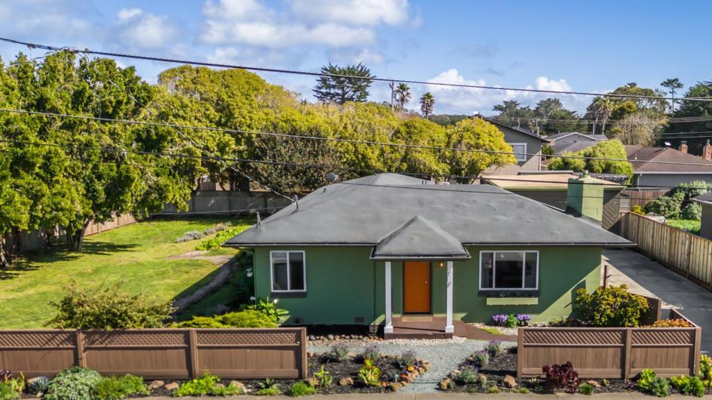 New Price! Want an ADU or RV/BOAT PARKING??? Charming single-family home offers a perfect blend of comfort and style and is situated on a LARGE 10,400 sf lot. Located on the Westside of Moss Beach, just steps of the gorgeous blufftops of the Pacific Ocean. With 1,630 square feet of thoughtfully designed living space, this residence provides ample room for relaxation and entertainment featuring three inviting bedrooms and two well-appointed bathrooms. The living area is bathed in natural light, creating a welcoming ambiance that flows seamlessly into the kitchen, perfect for hosting gatherings with family and friends. Retreat to the master bedroom, a peaceful sanctuary with an updated en-suite bathroom, providing a private oasis for relaxation along with a cozy sunroom that is the perfect spot for a home office. Outside, the property features an extra large yard, ideal for enjoying the coastal breeze and outdoor activities. Enclosed patio and extra large garage with ample space for a home workshop or even maybe an ADU? Experience the beauty and serenity of Moss Beach living at its finest with its great location to a local market, Taqueria, James Fitzgerald Marine Reserve, and harbor restaurants. Don't miss the opportunity to make this delightful home your own coastal haven.