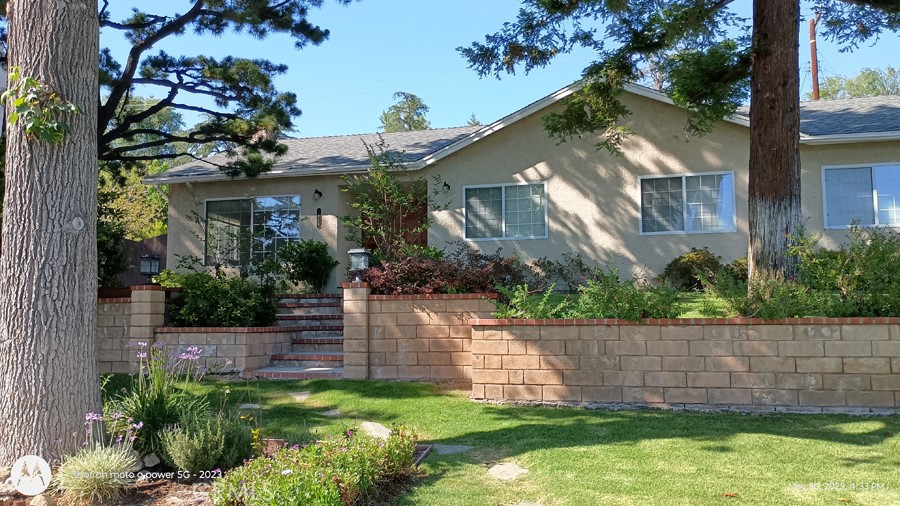 Welcome to this beautiful home in La Canada, featuring modern updates, and an expansive ADU. 5 bedrooms, 5 baths provide ample room for additional family or income opportunity. Primary house is 3 bedrooms, 2 baths with Laminate flooring. Large windows provide additional light and warmth while central air and overhead fans provide comfort and control. This home has Nest smart home thermostat for modern temperature adjustment. Double doors open to the generous living area and lovely brick fireplace. Dining area adjacent to the kitchen has sliding doors leading to the rear patio area. Kitchen is galley style with modern cabinets, Quartz counters, soft close drawers, and is adjacent to laundry for easy access. This updated home is equipped with security system and ring doorbell for complete safety and privacy.
Large primary bedroom comes with private bath and walk-in closet. Upgraded windows provide ample light with sliding door access to the rear patio. All bedrooms are large and have unique characteristics you will appreciate. Bedrooms have features different from each other, such as overhead fans with remote control, additional space for office or nursery, impressive lighting from double pane windows or sunroof for extra light and beautiful flooring throughout . Both homes are move-in ready complete with lovely landscaping.
ADU has oversized 2 bedrooms, 2 baths, AC and overhead fans. Living area is open to modern kitchen with access to a sunroom and additional studio area. Separate metering for electric, while laundry closet provides complete freedom and privacy. Modern laminate flooring and upgraded cabinetry with dual pane windows make this ADU special and ready to enjoy.
