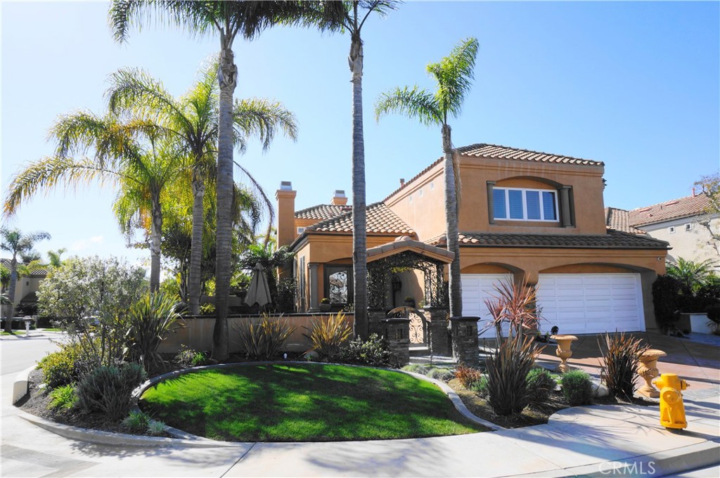 BEAUTIFULLY REMODELED BEACH-CLOSE HOME Located on a spectacularly landscaped corner lot within the prestigious 24-hour guard-gated community of THE ESTATES at SEACLIFF COUNTRY CLUB, this stunning residence offers over $500,000 in upgrades. The home features 4 bedrooms plus a den/office with its own bathroom. Cozy fireplaces are found in the living room, family room, and a see-through fireplace connecting the master bedroom to the master bathroom. Upstairs, the expansive master retreat boasts an open balcony, a huge walk-in closet with custom built-ins, and a luxurious master bath with a jetted spa tub and separate shower. Also on the second level are a junior suite with its own bath and two additional bedrooms that share a Jack-and-Jill bathroom. The entryway welcomes you through a private courtyard with a large fountain, leading to a grand wrought-iron and glass double-door entry. The backyard is an entertainer’s dream: *Custom hardscape with a dual-sided fireplace and built-in seating. *Covered gazebo with wood-plank ceiling, two built-in heaters, and an inviting lounge area. *Built-in Lynx BBQ with pizza oven and a floating glass table. *Pebble-tec mosaic spa with waterfall feature, illuminated at night. *Two fire-on-ice firepits plus a large side yard with an additional stone fire pit. *Additional highlights include extensive custom woodwork, a wine cellar, an entertainment center in the family room, and built-in speakers throughout. Rent includes: furniture, wall-mounted TVs, gardening service, and spa maintenance. Must see to fully appreciate!