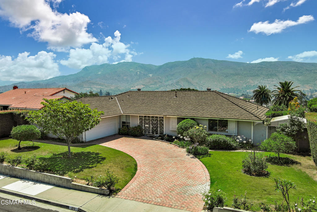 VIEW HOME!!!! Welcome to the ultimate California dream home, perched in the scenic hills of Santa Paula! This gorgeous single-story home offers 2,100 sq ft of light-filled living space on a generous 1/4 acre lot, with sweeping views of the surrounding mountains and valleys. The living room features a cozy fireplace and is bathed in natural light, while the spacious family room/den is surrounded by windows that frame breathtaking sunsets and lush hillside vistas, making it the perfect spot to relax or entertain. The large kitchen is a chef's dream with double ovens, ample cabinet space, and a seamless flow into the formal dining room and breakfast area. Retreat to the expansive primary suite, where French doors lead to the patio for you to soak in the views. The luxurious primary includes multiple closets, a fireplace, and a spa-like bathroom with a walk-in shower and a jetted tub where you can relax and take in the panoramic mountain views. Outside, enjoy the ultimate entertaining space with a custom paver patio surrounded by mature avocado, lemon, tangerine, kumquat and orange trees. The tranquil backyard feels like you're on top of the world--perfect for al fresco dining, stargazing, or simply enjoying the serene landscape. Don't miss this rare opportunity to own a slice of paradise in the heights of Santa Paula--a home where every day feels like a vacation.