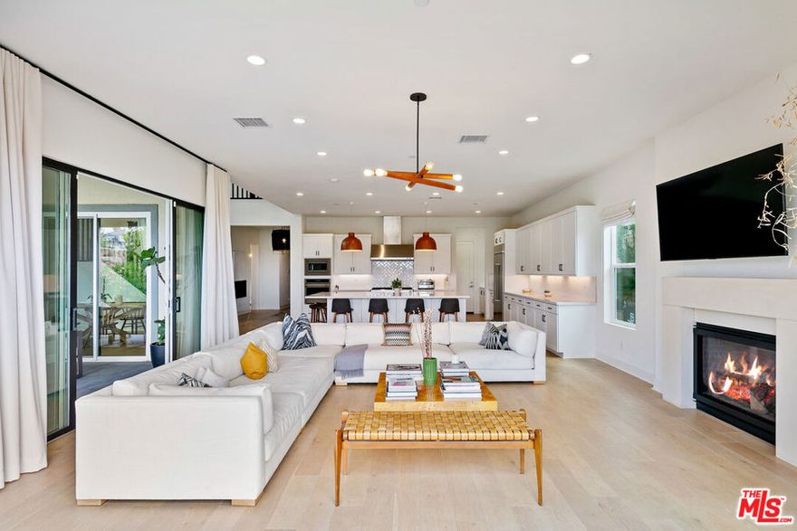 This newer-construction residence blends modern luxury with thoughtful design and an open floor plan. Upon entering, you are greeted with an abundance of natural light provided by the lofty ceilings. At the center of the home is a chef's kitchen with quartz countertops, premium built-in appliances, walk-in pantry, and sleek finishes. The open-concept living and dining areas extend to a private backyard, perfect for entertaining and offering seamless indoor/outdoor living. Each bedroom is en-suite, ensuring privacy and comfort. The primary retreat is a true sanctuary with a spa-inspired bath featuring a freestanding soaking tub, dual vanities, and a walk-in closet. Additional amenities include a private Sport Court, built-in surround sound, smart home capabilities, and premium designer touches throughout. This exceptional home delivers both elegance and convenience in one of the area's most desirable communities. Residents of Deerlake Ranch enjoy access to premium community amenities, including a recreation center, pool/spa and a dog park designed for both convenience and lifestyle.