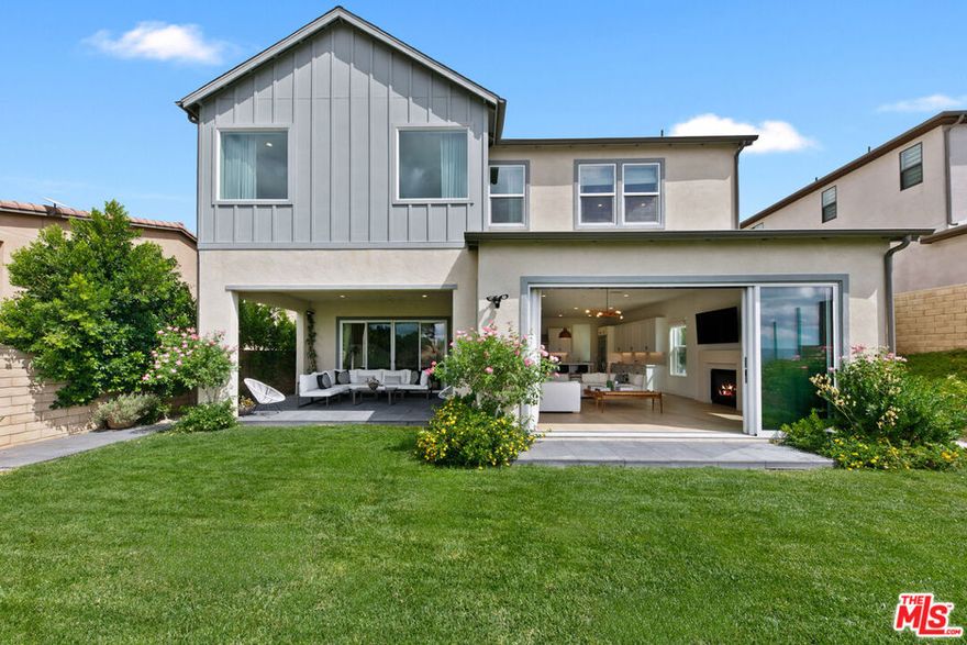 This newer-construction residence blends modern luxury with thoughtful design and an open floor plan. Upon entering, you are greeted with an abundance of natural light provided by the lofty ceilings. At the center of the home is a chef's kitchen with quartz countertops, premium built-in appliances, walk-in pantry, and sleek finishes. The open-concept living and dining areas extend to a private backyard, perfect for entertaining and offering seamless indoor/outdoor living. Each bedroom is en-suite, ensuring privacy and comfort. The primary retreat is a true sanctuary with a spa-inspired bath featuring a freestanding soaking tub, dual vanities, and a walk-in closet. Additional amenities include a private Sport Court, built-in surround sound, smart home capabilities, and premium designer touches throughout. This exceptional home delivers both elegance and convenience in one of the area's most desirable communities.