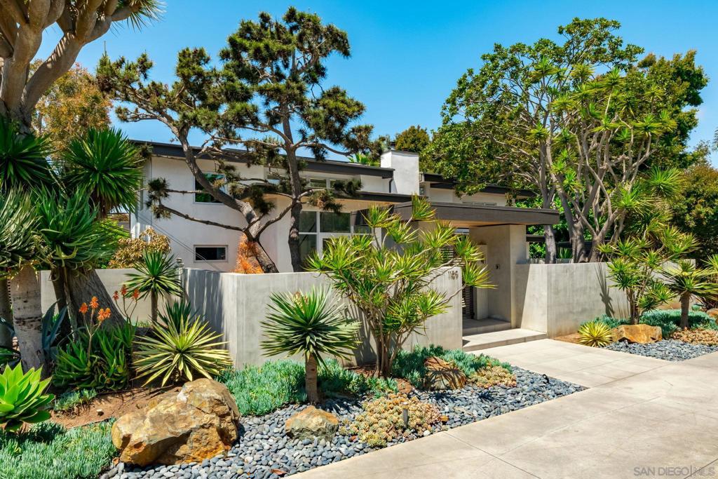 One of the most spectacular homes, on one of the most private lots, on one of the most desired streets in all of Leucadia! Created by Legendary Encinitas architect Steve Adams, this masterpiece sits at the end of a private cul de sac, just a few blocks from Beacons Beach and all the shops and restaurants that downtown Encinitas has to offer. Enter a private gate to your peaceful escape and open the front door to stand in awe of the double height entry with two modern staircases and a full view to the backyard with overflow spa, outdoor shower, fire pit, built-in bbq area and enough yard to entertain all of your friends. Multiple oversized Fleetwood doors seamlessly blend the outside in, and truly gives you indoor/outdoor living year around. The reimagined kitchen offers two waterfall edged islands, floor to ceiling cabinetry and a breakfast nook that overlooks your backyard oasis. With the home's open floorpan, the kitchen seamlessly opens to a gracious family room that overlooks a private front courtyard. One optional primary bedroom is conveniently located on the first floor and offers an incredible spa inspired bathroom and large infinity door that leads to the backyard. Each staircase leads you to spacious bedrooms, one being the magnificent primary, which is surrounded by windows to enjoy the sunshine and ocean breezes, and also offers ultimate privacy with the mature landscaping. Contemporary by design, a wonderful micro climate by location, and a jewel by the sea, welcome to 1159 Hymettus Avenue.