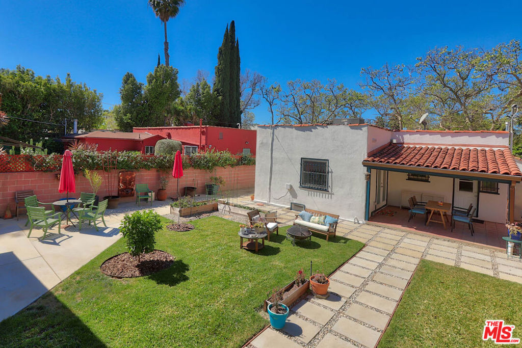 Charming 1922 Spanish home with a detached guest unit perfect for a home office, writer or musician studio or your out-of-towners visiting L.A. Located just North of Melrose Ave and adjacent to Hancock Park recently remodeled featuring hardwood floors, recessed lighting, central heating and air, window treatments and a gourmet kitchen with breakfast bar. The property faces West and is flooded with natural light. Fireplace in living room. Large backyard with several fruit trees, multiple seating areas and lots of room for the aspiring or experienced gardener to grow their own vegetables, herbs and flowers. Detached converted garage studio with bathroom plus a single empty garage bay for additional storage. Minimum one year lease. Close proximity to Hollywood, Runyon Canyon, the Farmers Market and the shops, restaurants & cafes along Melrose Ave and Larchmont Ave. This is a special one for those looking for an updated home with great outdoor space and privacy. Dogs o.k. First showings Tuesday, October 14.