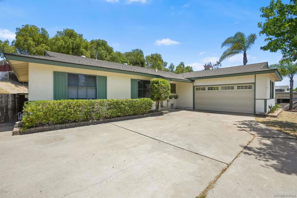 Charming Home in Desirable Southwestern College Estates! This warm and inviting residence sits on an expansive lot and is ready to welcome its next owner. The remodeled kitchen features sleek granite countertops, stainless steel appliances—including a gas range, built-in microwave, refrigerator, and dishwasher. The spacious living room impresses with soaring cathedral ceilings accented by striking wood beams, creating a dramatic and cozy atmosphere. Down the hall, you'll find four comfortable bedrooms, a stylishly updated hall bathroom, and a beautifully remodeled primary ensuite bathroom. Step outside to a huge backyard perfect for entertaining, complete with two covered patios and a thriving lemon tree—an ideal canvas for your outdoor dreams. Large garage, washer/dryer included, and don't miss the brand new water heater!