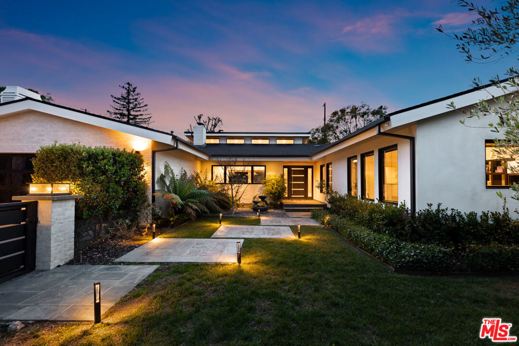 An amazing remodel in Encino Woods. Bask in the contemporary vibe of this upgraded 4 + 3.5 Smart Home with phone app control, energy efficient double pane windows, hardwood floors, calming color palette, soaring ceilings and skylights. Wrap around glass pocket doors enclose the fireside living room. Open to the spacious dining/great room, a crisp black & white gourmet kitchen features Thermador appliances, quartz countertops, 10ft waterfall island with seating for four, subway tile backsplashes, pot filler faucet, and wine bar with fridge and bottle display. Walls of glass invite indoor/outdoor living to resort-style grounds, patio with beautiful wood ceiling, BBQ, pool with Baja shelf and spa. A relaxing haven, the main en suite offers a lux soaking tub, shower room and dbl + sit-down vanities, poolside patio, custom dressing room, fireplace and built-ins. A home that is as smart as it is gorgeous! Near Ventura Blvd., Westside, desirable Hesby K-8 School Dist., parks etc.