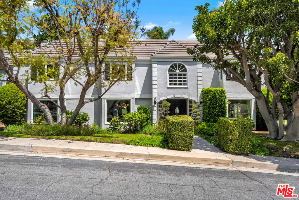 Tremendous opportunity. The largest home in Pacific Palisades on the market for under $4 Million. Situated on a quiet cul-de-sac in the highly desirable 24-hr guard-gated Palisades Country Estates, this spacious home has a private pool, spa, outdoor bbq and grassy yard. The upstairs has 5 bedrooms, while there is a 6th bedroom on a separate level. The main floor of this stately residence offers a family room with brick surround fireplace and bar, large living room with stunning fireplace mantle and surround, a modern kitchen with eat-in breakfast area and formal dining room. Finally, the loft would make a great game-room, office or play area. The motor-court with 3-car garage provides plenty of off-street parking. Your chance to move in to a 6- bedroom home rarely available in this price category. No houses on the street were lost to the fire and residents have been back enjoying their homes in this sought after community. Furniture is available if Buyer is interested.