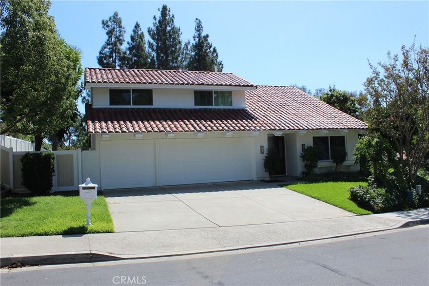 Very nice large family home, with four bedrooms (one bedroom downstairs) with 1/2 bath downstairs, Large master and two other bedrooms upstairs. Leaded glass entry doors, vaulted ceilings and large windows with lots of light. Custom lighting in large living room and formal dining room, kitchen has upgraded custom cabinets, all new appliances, quartz countertops, tiled backsplash and connects to family room with fireplace. Upstairs master bedroom is huge with sitting area and fireplace. Dressing area with mirrored wardrobe closet doors. Unique mirror over custom vanity and large walk in frameless shower. The two secondary bedrooms on this level are also nice size, both with mirrored wardrobe doors and a shared bathroom with all upgraded tile, tub, and frameless glass shower doors. Custom lighting and mirror. Other Amenities: plank porcelain tile throughout the downstairs and upstairs baths, all new carpet throughout upstairs, very large hall linen closet with tons of shelving. This home is located on a small cul-de-sac, walking distance to Mission Viejo High School, La Paz Intermediate Jr High, and De Portola Elementary School. This is a great  home!