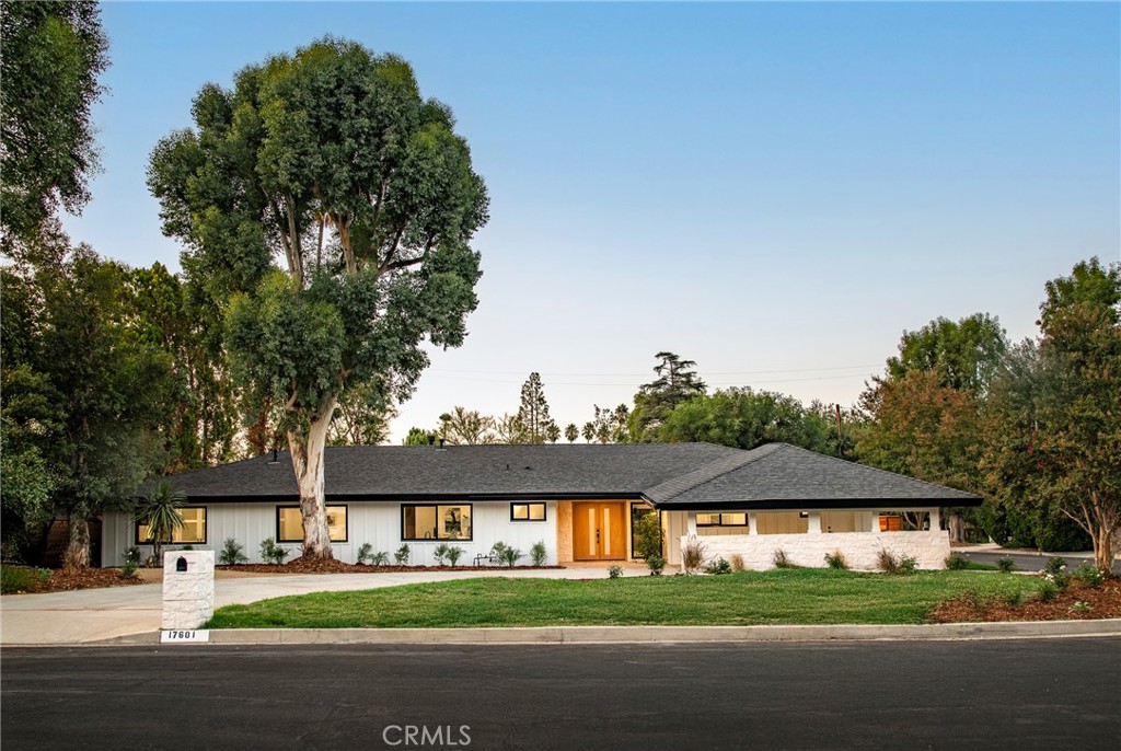 Welcome to this stunning single-level estate, tucked away on a private corner lot in Encino’s coveted Amestoy Estates. Recently and thoughtfully renovated, this home blends modern luxury with everyday comfort, offering an exceptional lifestyle in one of the Valley’s most sought-after neighborhoods. Step inside to an abundance of natural light and an open layout that immediately sets the tone. Expansive windows and bifold doors seamlessly connect the interiors to the outdoors, showcasing beautifully landscaped grounds, a resort-style pool, and inviting entertaining spaces—all while filling the home with warmth and light. The open-concept design effortlessly links the chef’s kitchen, living room, family room, and dining area, creating a functional flow that is ideal for gatherings and adapts seamlessly to both lively celebrations and quiet evenings. The spacious primary suite serves as a private retreat, with large sliders framing serene backyard views, a spa-inspired en-suite with dual vanities and a walk-in shower, and immense closet space. Four additional bedrooms provide flexibility for family, guests, or a home office. The backyard is a true California paradise, with a PebbleTec pool featuring cascading water features, multiple lounge and dining areas, a built-in BBQ, and a lush green lawn, creating an outdoor sanctuary designed for both unforgettable entertaining and everyday relaxation. Equally impressive, the front yard offers striking curb appeal with meticulously landscaped grounds and an expansive driveway that blends elegance, functionality, and a grand sense of arrival. All of this sits on over a quarter-acre flat lot, just minutes from the vibrant energy of Ventura Boulevard with premier dining, shopping, and entertainment. Here, style, comfort, and location come together—this is California living at its finest.