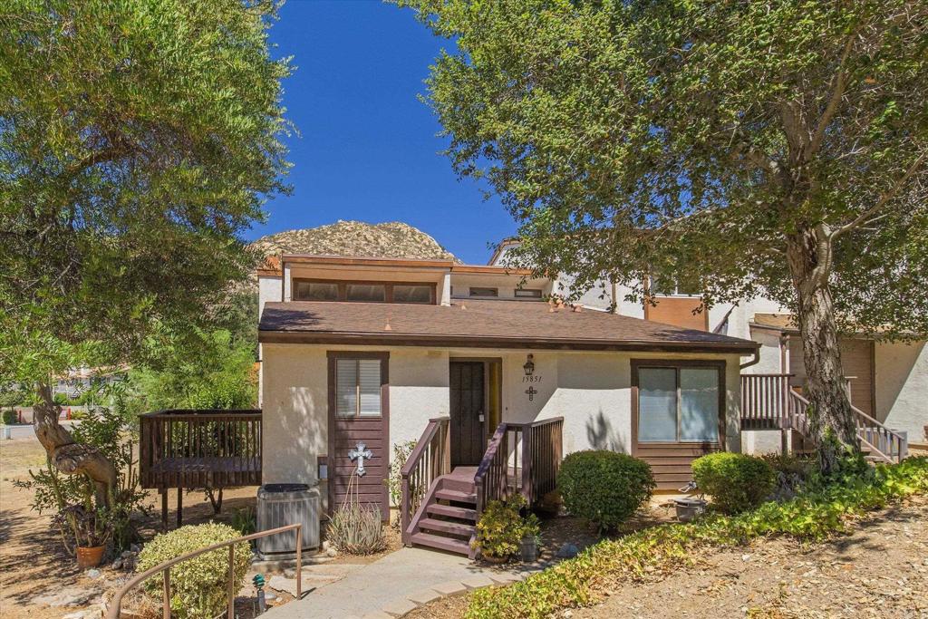 Take in the views of the mountains and enjoy great location on this nicely priced end unit condo, is clean and ready for someone to call it home. Includes a 2 car garage and 2 decks to enjoy the mountain views. Wiith vaulted ceilings and open beam detail make for a spacious living experience. There is a bonus space in the converted attic perfect for an office or kids space (not included in square footage) You will love the location within the complex, walking distance to Ramona Oaks Park and the Concert in the Park Events, 4th of July Parade and close to hiking trails, main road and more....you will be saying "I have to live here"