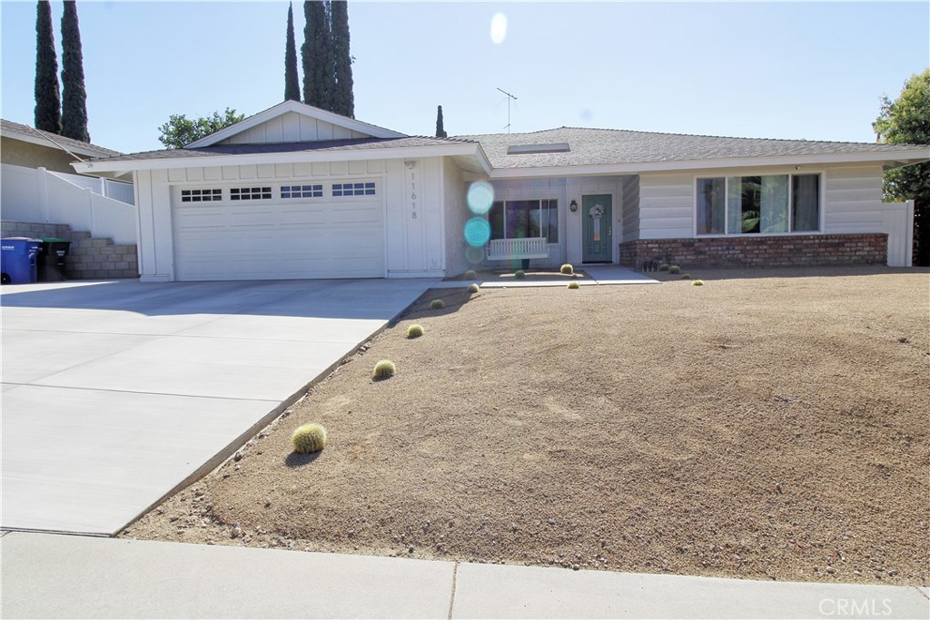 Spend afternoons enjoying the porch swing at this beautiful Loma Linda single story. A spacious 2200 square foot layout features large formal living and dining room. Updated kitchen with white shaker cabinetry and stainless steel appliances. Family room with painted brick fireplace is open to eating area and kitchen. Four large bedrooms all with ceiling fans, large windows and plank flooring. Both bathrooms have been updated with white shaker cabinetry and beautiful fixtures. Easy care landscape, a mature lemon tree, covered patio, two car garage and extra wide driveway makes this home complete. This one won't last long!