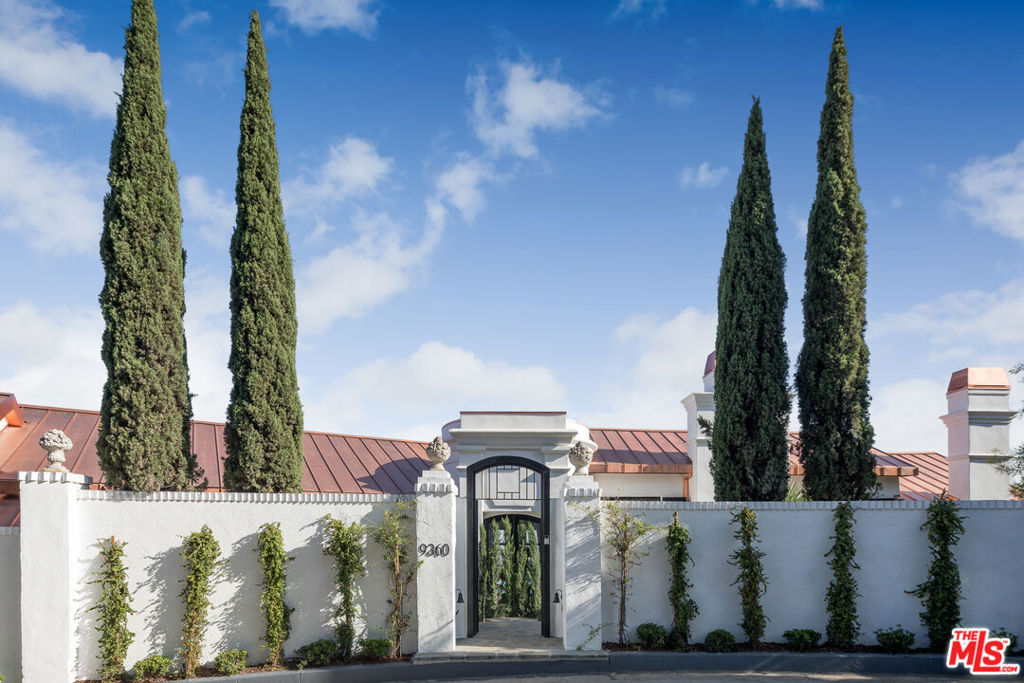 Overlooking Beverly Hills - with unobstructed views from the ocean to downtown Los Angeles. Originally built in 1926 and once owned by esteemed architect John Elgin Woolf, this designer renovated property reflects the grandeur of Hollywood's golden age, combined with today's amenities. A dramatic formal entry leads to formal Living Room with outdoor veranda, Wood Paneled Library/Media room, Formal Dining Room that can accommodate large or intimate dining -the Family Room & Gourmet Kitchen complete the first floor. An incredible Master Suite with Living Room & fireplace; Spa bath and beautiful vistas of the pool & city views. 4 additional en-suite bedrooms complete the lower level.