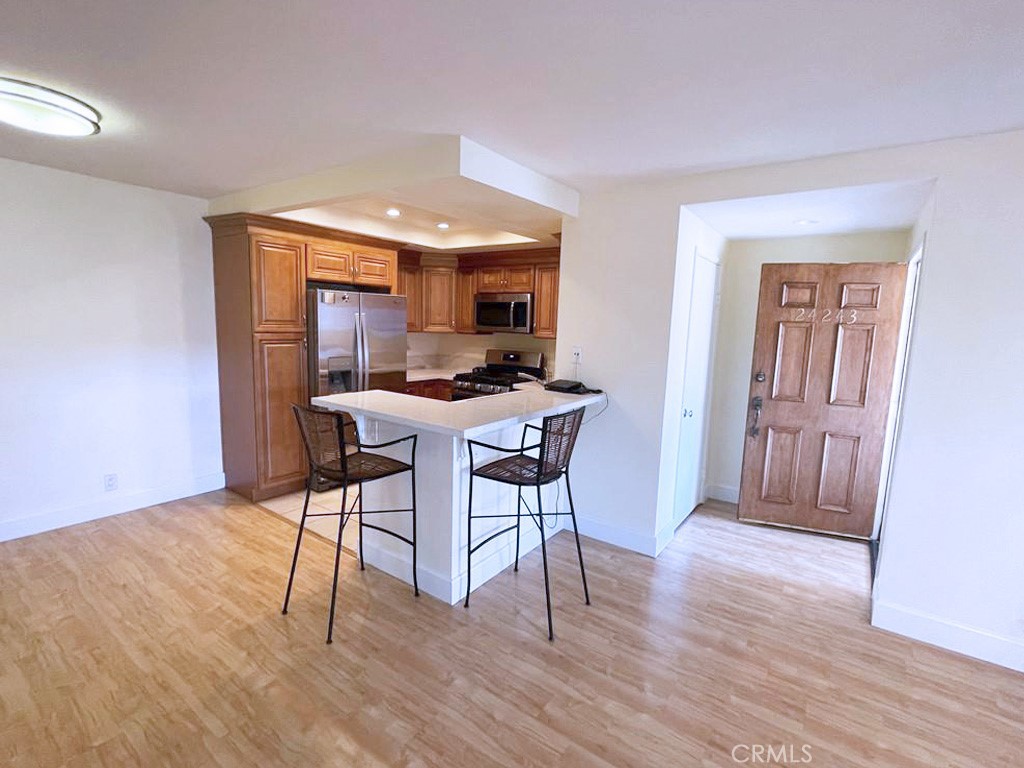 Upper-level unit in a highly desired gated community of Casa La Paz in Laguna Niguel. Freshly Painted Unit. The kitchen is upgraded with Stainless Steel Appliances, New Stove and Oven, New Microwave and New Dishwasher. It also has a a Breakfast Nook. Laminate Flooring throughout the unit. Stackable washer/dryer in the unit. Walking closet in the bedroom. The unit comes with one assigned parking space. The community provides access to a pool and spa. Enjoy the convenience of walking to shopping and dining across the street, including Target, Costco, In-N-Out, Starbucks, Home Depot, Sprouts, and more. A short drive takes you to Aliso Viejo Town Center with additional retail, restaurants, and entertainment options including Edwards IMAX Theater. Easy access to the toll road.