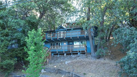 Photo of 31954 Pine Cone Drive, Running Springs, CA 92382 (MLS # CV25152078)
