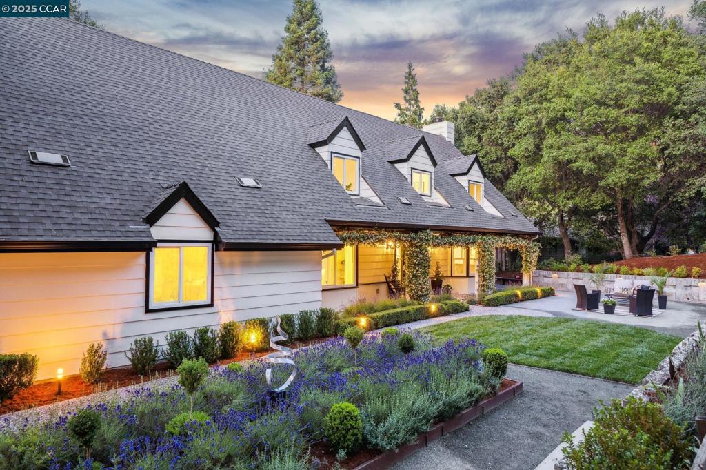 Nestled on a quiet court in the highly sought-after Glorietta neighborhood, this California Cape Cod-inspired home welcomes you with fragrant lavender & formal garden leading to a jasmine-framed entry. Custom built by an engineer/surveyor for his family, this timeless beauty—on the market for the first time—sits on a mostly flat lot of over half an acre. The beautifully landscaped backyard offers a spacious new lawn, vegetable & herb gardens & multiple seating areas ideal for outdoor dining/entertaining, whether you're hosting an intimate gathering or a lively crowd. Inside, more than 3,400 square feet of living space includes 4 generously-sized bedrooms, updated baths, a versatile playroom/office, & a private balcony off the primary suite. The expansive living room features a fireplace & outdoor access and the formal dining room offers built-in storage. A cozy family room sits adjacent to the kitchen and informal dining area. The large laundry/mudroom comes equipped with a washer, dryer, and utility sink. The oversized garage includes a workshop area while the driveway provides ample parking for a RV/boat. Top-rated schools & Meadow Swim/Tennis Club are just minutes away from this central location, offering a perfect blend of comfort, convenience & classic California charm.