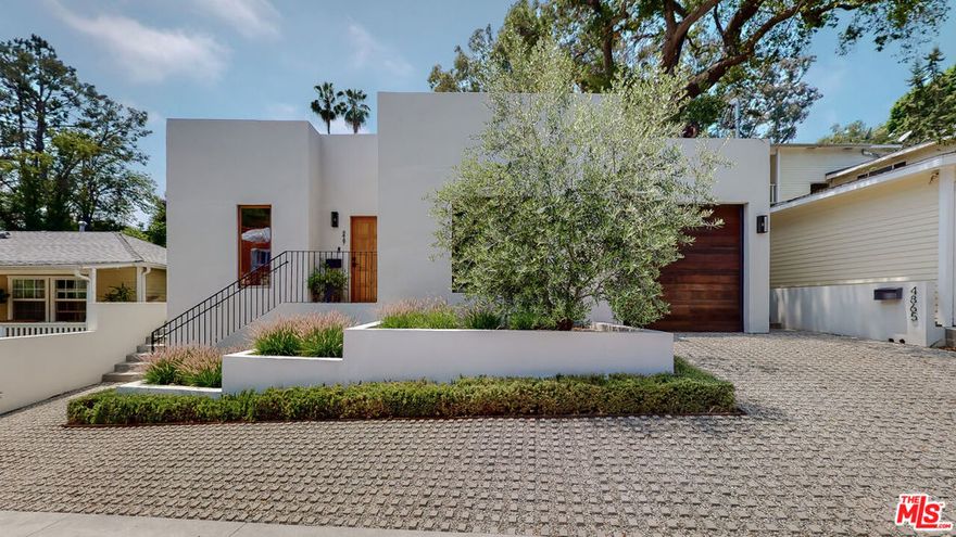 Perched on a quiet cul-de-sac in the hills of Eagle Rock, this newly developed Mediterranean-inspired home embodies the essence of refined Southern California living.  Thoughtfully designed with architectural precision and built to the highest standards, the residence offers a harmonious blend of light, space, and texture that feels both luxurious and welcoming.  Upon entering, you are greeted by an expansive open-concept floor plan that immediately captures the eye with its soaring 12-foot ceilings, walls of glass, and an effortless indoor-outdoor transition. The great room flows seamlessly into a gourmet chef's kitchen that serves as the heart of the home. Outfitted with a striking La Cornue range, bespoke white oak cabinetry, honed limestone countertops, and a dramatic waterfall-edge island, this kitchen is as functional as it is breathtaking equally suited for intimate family dinners or large-scale entertaining.  The adjoining dining and living spaces open to multiple outdoor areas, where verdant landscaping, gentle breezes, and serene hillside views set the stage for relaxed al fresco gatherings. Morning coffee on the patio, weekend barbecues, or sunset cocktails, every moment here feels like an escape.  The residence includes three generous bedrooms and three meticulously designed bathrooms. The primary suite is a private retreat reminiscent of a boutique hotel, complete with a spacious walk-in closet, a tranquil spa-like bathroom featuring custom tile work, a large glass-enclosed shower, and direct access to two separate patios. Each finish and fixture throughout the home has been hand-selected to convey understated elegance and natural beauty, from the soft oak tones and stone surfaces to the sleek matte hardware.   This impeccable property offers versatility, privacy, and timeless appeal. This property is a sanctuary, away from the bustle of the city, and delivers a rare balance of elegance and functionality.Perfectly situated in a central NELA location, you are moments away from the acclaimed dining, shopping, and culture of Colorado Boulevard, while still enjoying the tranquility of hillside living. This is Eagle Rock at its most sophisticated home where every detail invites comfort, beauty, and connection.